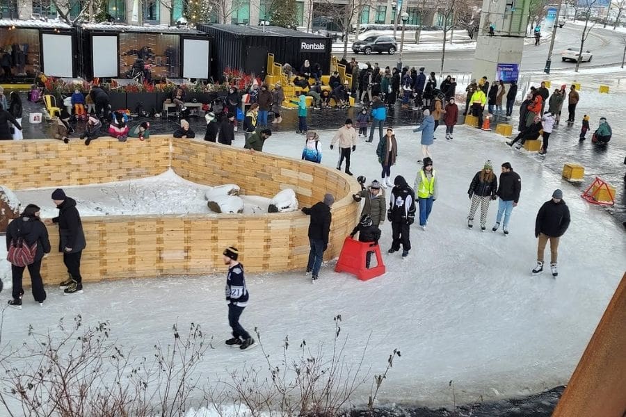 People are skating outdoors at The Bentway in Toronto, Ontario. Outdoor skating is a popular Family Day activity. 