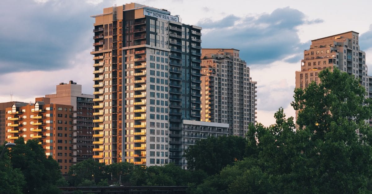Modern high-rise residential apartment buildings in a Canadian city for newcomers looking to rent in Canada without a credit history