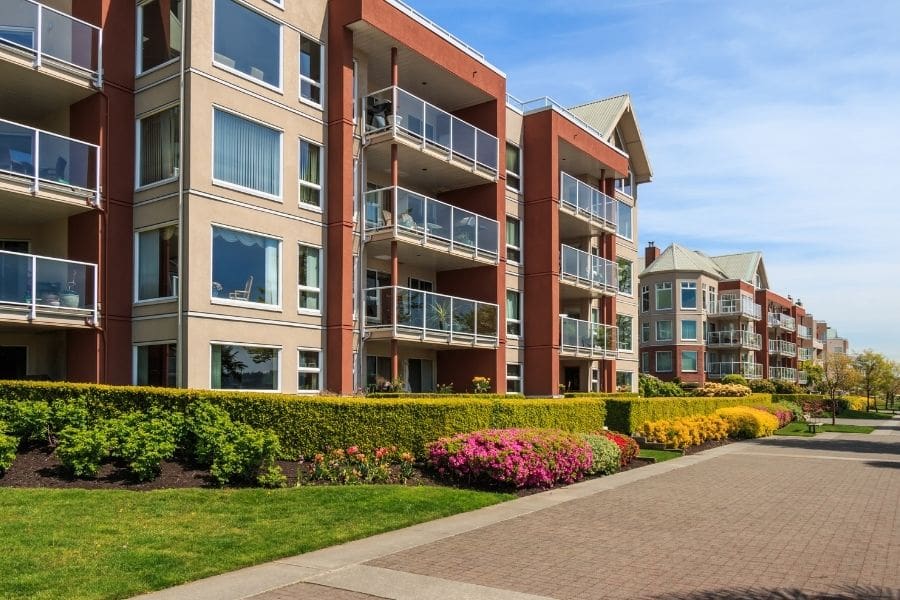 Low-rise building in New Westminster, British Columbia. Choosing affordable neighbourhoods in Canada helps newcomers save money on rent. 