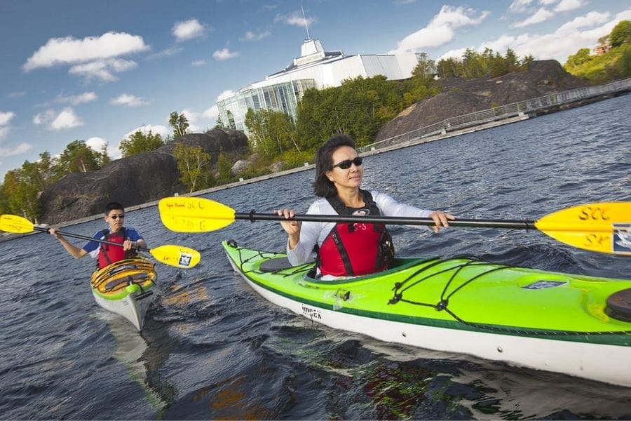 Mother and son kayaking on Lake Ramsay near Science North. Image Source: Destination Ontario.