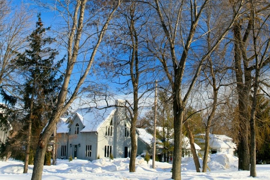 Quiet tree-lined residential street with detached family homes in the Sunnidale neighbourhood of Barrie, Ontario.