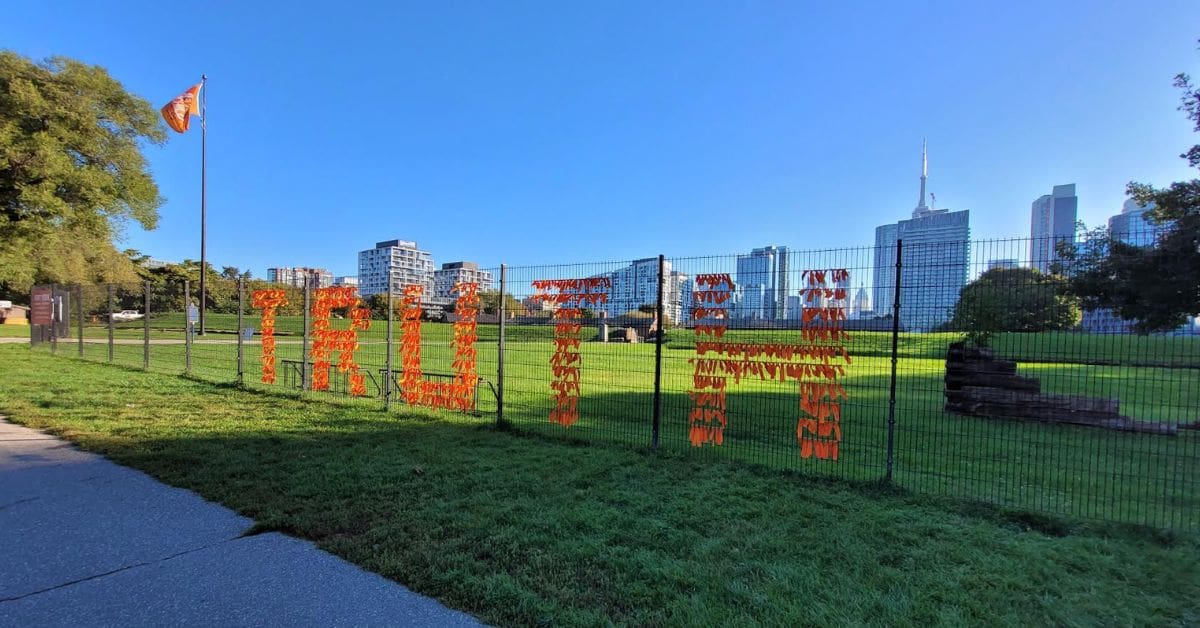 An Every Child Matters flag is raised at the Fort York National Historic Site in honour of the National Day for Truth and Reconciliation.