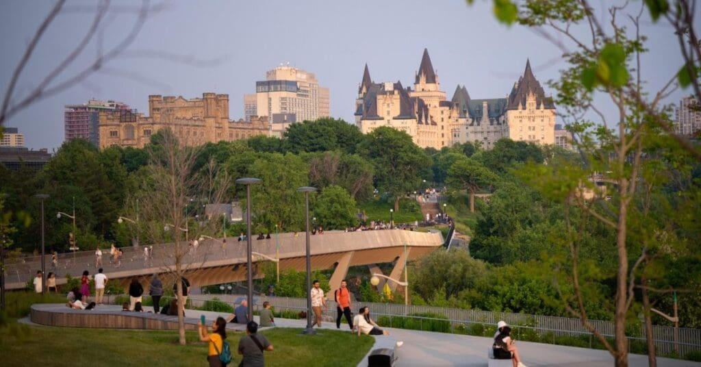 People are crossing over a bridge at Kiweki Point in Ottawa, Ontario Canada. Source: Destination Ontario