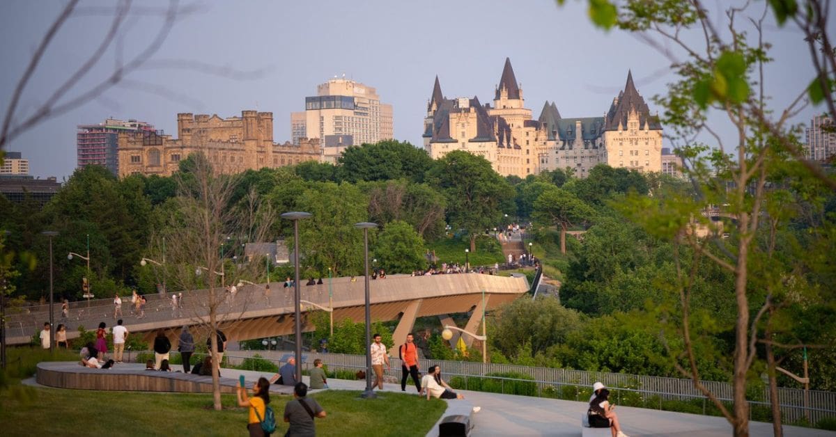 People are crossing over a bridge at Kiweki Point in Ottawa, Ontario Canada. Source: Destination Ontario