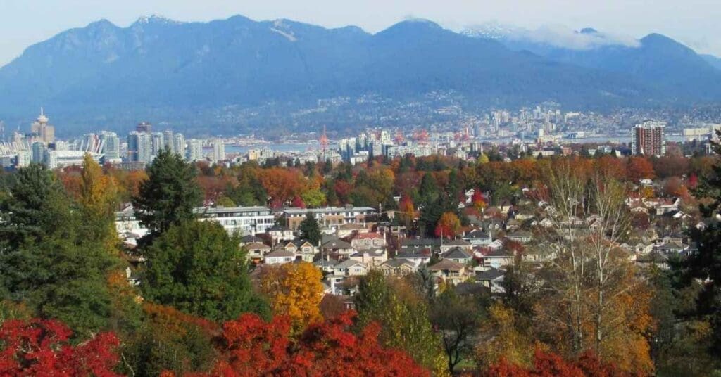 Scenery of Vancouver residential neighbourhoods, downtown skyline, and North Shore mountain, showcasing some of the best areas to live in Vancouver, Canada.