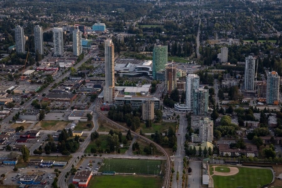 Aerial image of Surrey, British Columbia showing urban centres, residential areas, and parks — key neighbourhood features for newcomers.