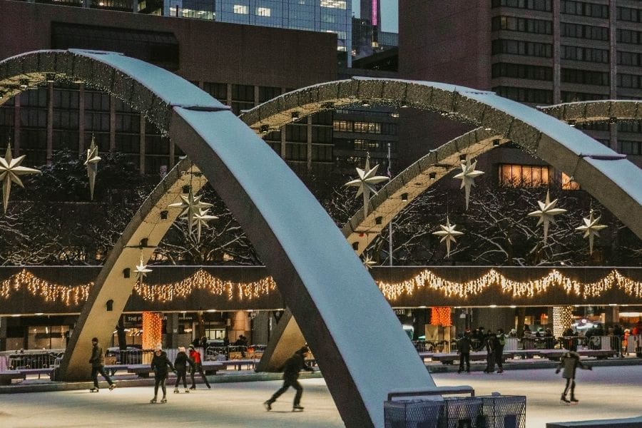 People skating outdoors in Toronto, Canada during winter and New Year’s Eve celebrations.