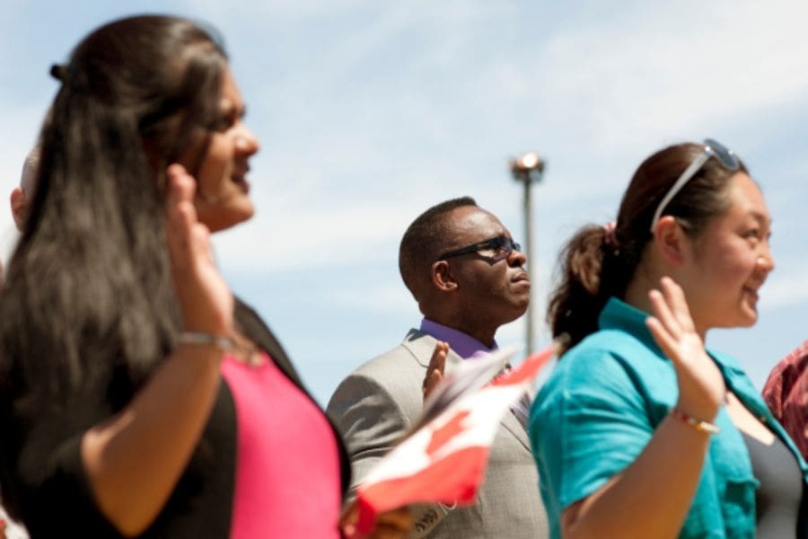 Newcomers attending a Canadian citizenship ceremony on Canada Day.