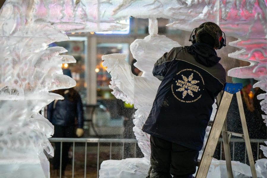An artist is putting the final touches on his ice sculpture at Winterlude in Ottawa. 