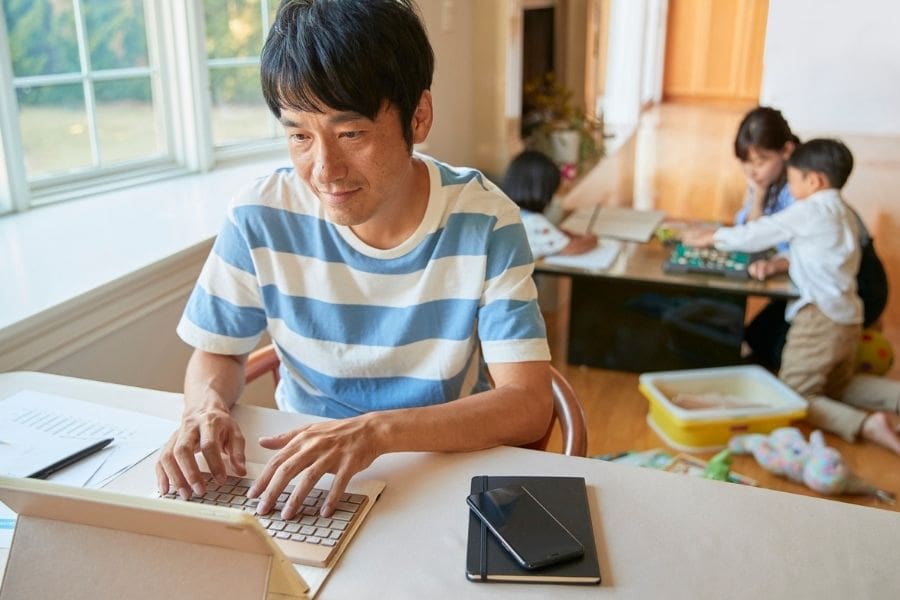 Newcomer parent reviewing a rental budget for family housing in Canada.