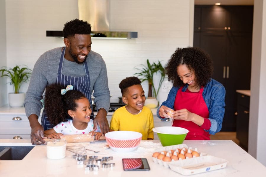 Family baking together at home during March Break in Canada