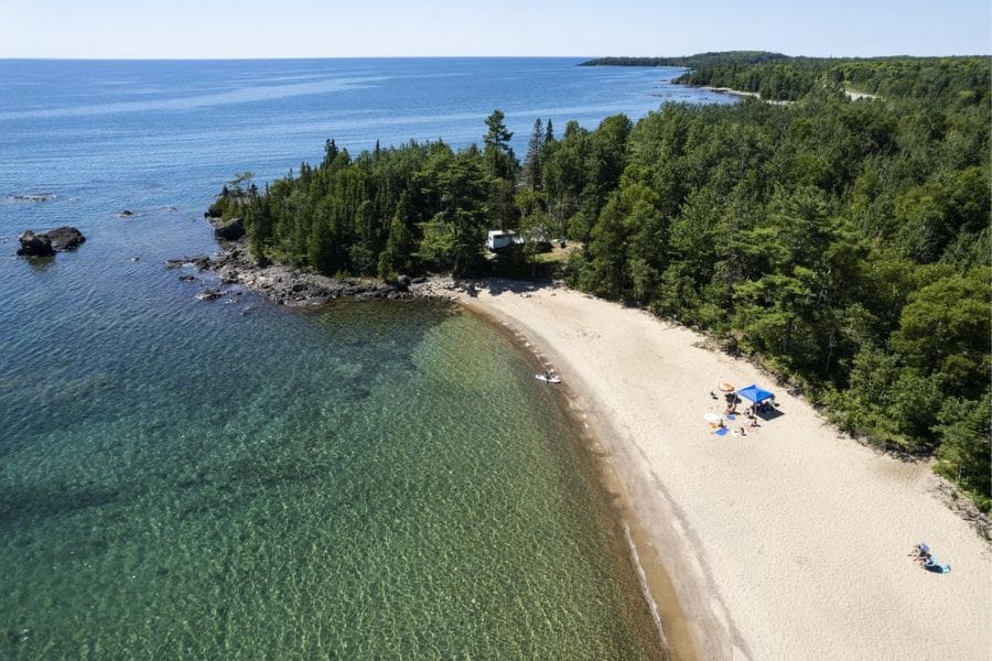 A stunning aerial view of Pancake Bay on Lake Superior, a beautiful spot for outdoor fun near Sault Ste. Marie.