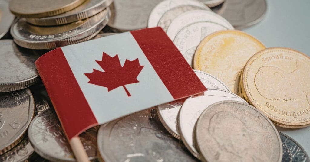 Canada PR fee increase 2026 shown with Canadian flag and coins for IRCC application budgeting.