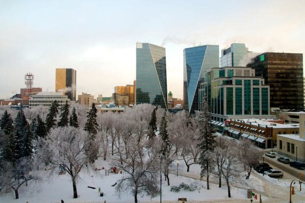 A view of downtown Regina and Victoria Park blanketed in winter snow, showing urban conditions for newcomers.