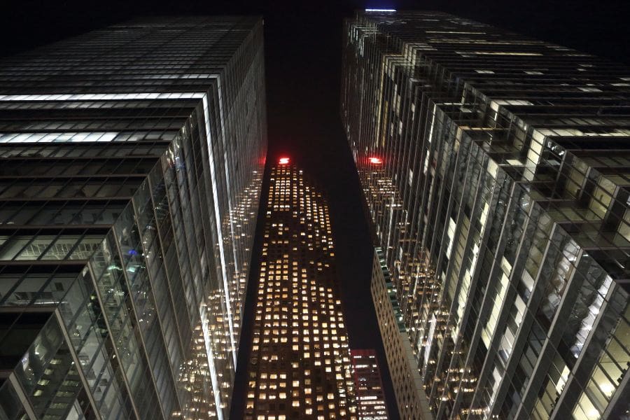 Low-angle night view of illuminated skyscrapers in Toronto's Financial District, one of the top industries in Toronto.
