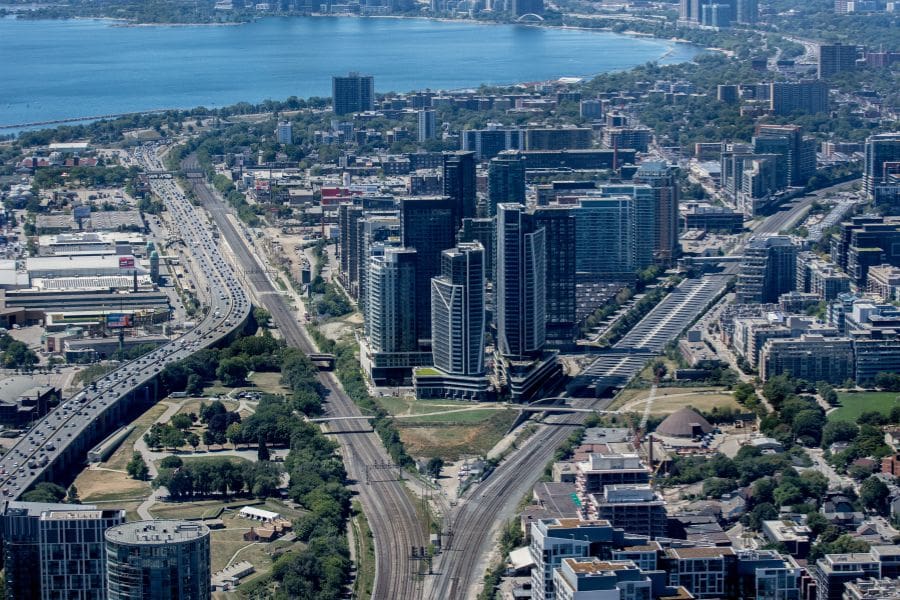 Aerial view of modern high-rise condo buildings and apartments in Toronto, showcasing urban residential options and transit corridors.