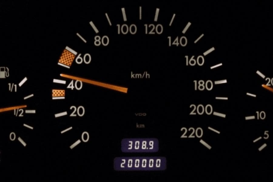 Vehicle instrument cluster showing speed in km/h, illustrating how controlling your speed helps save money on gas in Canada.