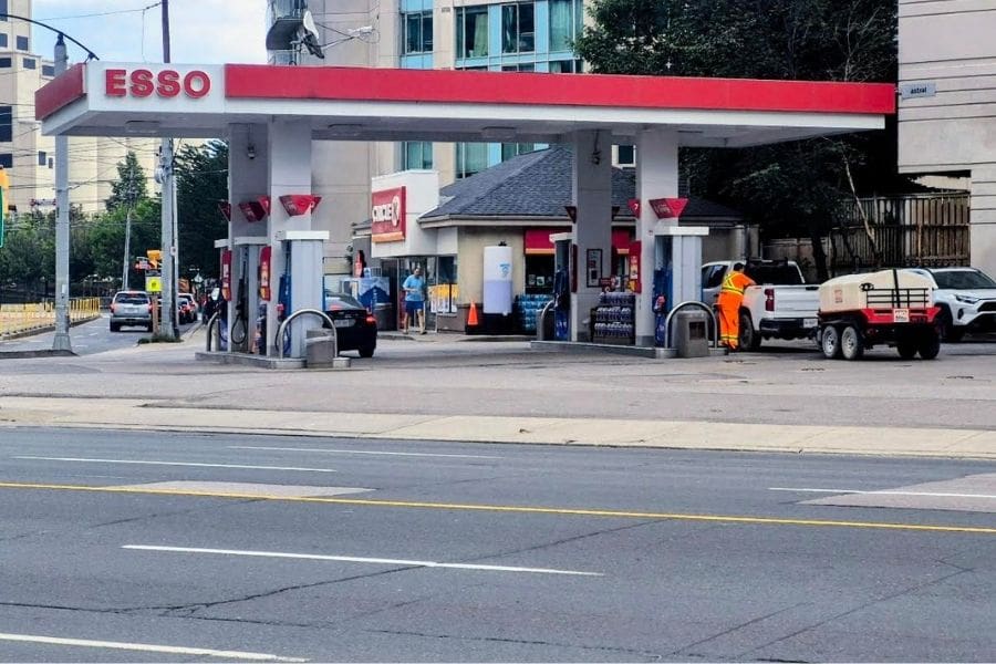A Canadian Esso gas station and convenience store, illustrating local options to save money on gas in Canada.