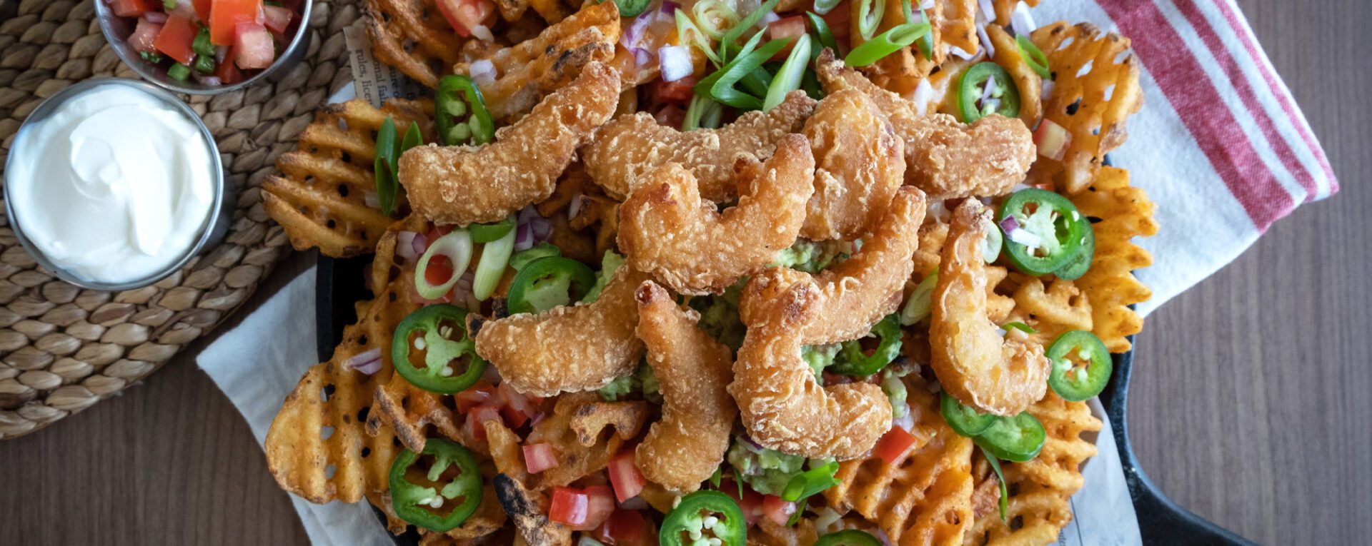 Irish nachos featuring guinness beer battered shrimp waffle cut fries chef connexion